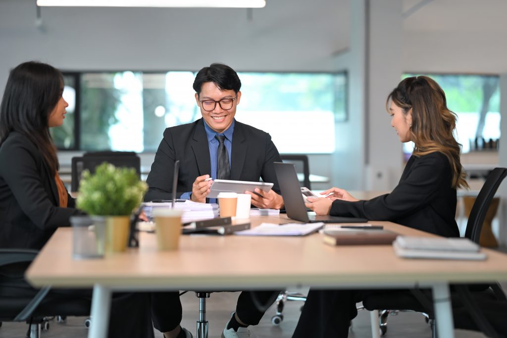 Business team discussing strategies to identify the Best SMS Service Provider for international reach