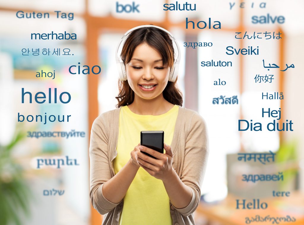 Woman using smartphone surrounded by greetings in many languages, representing global communication by the best SMS service provider.