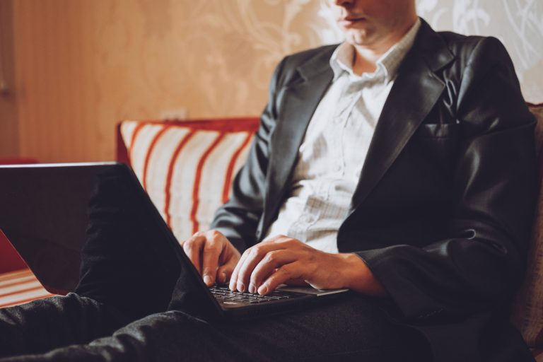 Business team using digital devices to plan omnichannel marketing with an SMS Gateway Provider integration