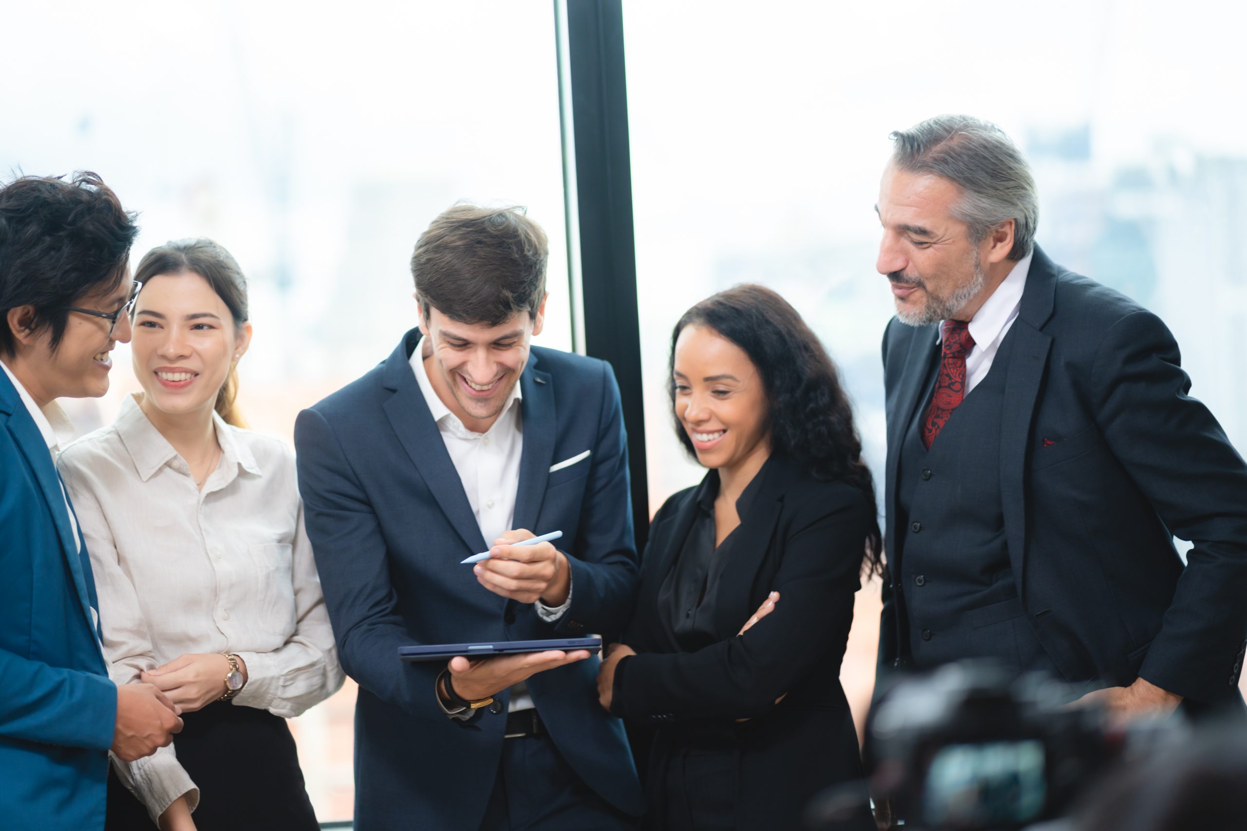 Team of professionals discussing a project together, illustrating collaboration in building secure systems that send SMS API messages.