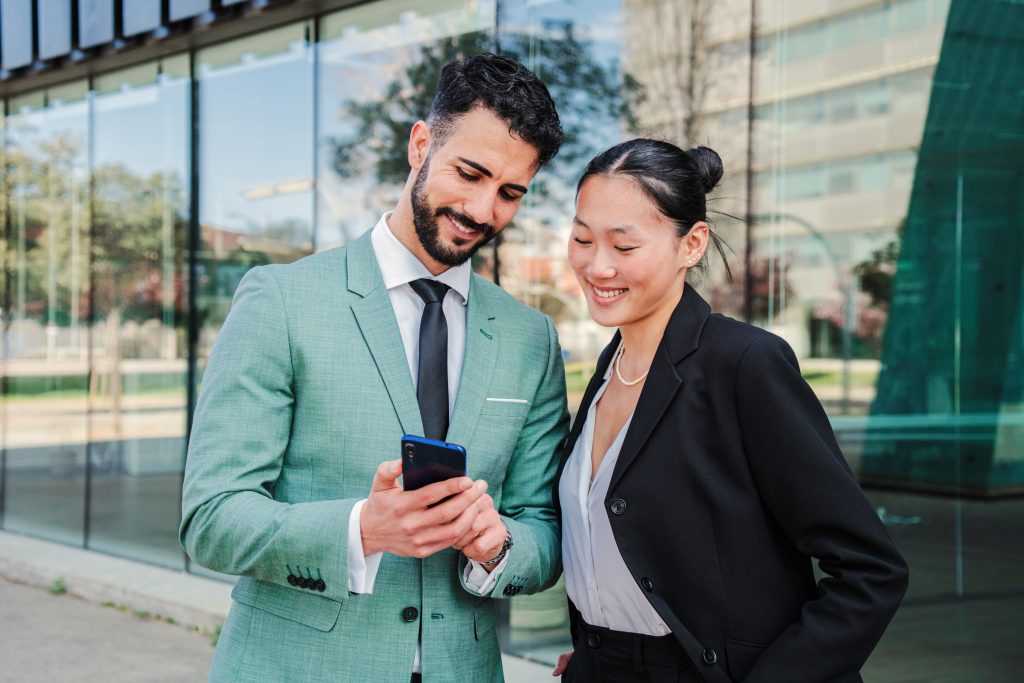 Developer using a laptop to test a Messaging API on a clean workspace with coffee and stationery