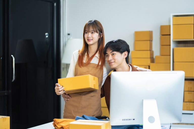 E-commerce team managing online orders while using a programmable SMS API to communicate with customers.